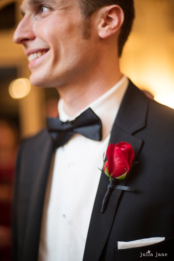red rose boutonniere at black tie wedding