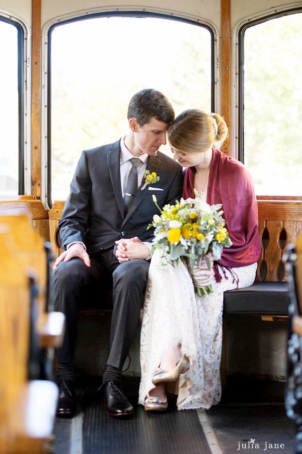 bride and groom in essex, ct on a trolley